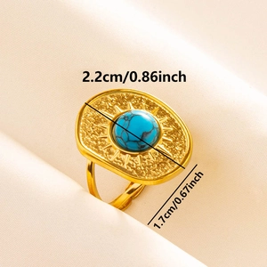 Close-up of retro 304 stainless steel ring with turquoise stone and radial sun texture