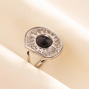 Detailed close-up of retro 304 stainless steel ring with black stone and sunburst pattern