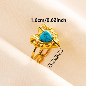 Detail showing gold heart ring with turquoise stone and hammered texture, 1.6cm size