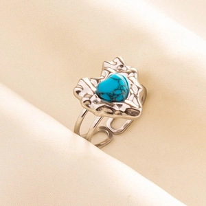 Detail of silver 304 stainless steel ring featuring a blue turquoise heart stone inlay