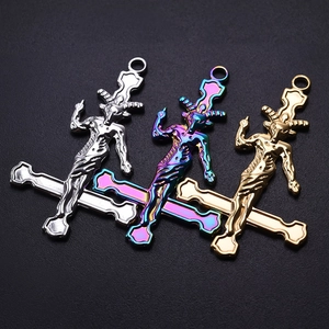 Detailed trio of 18k gold, silver, and iridescent goat head gothic cross pendants