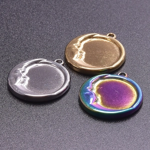 Macro detail of 304 stainless steel moon face pendants for DIY jewelry making