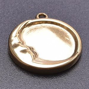 Detail showing 18k gold moon face embossed pendant for DIY jewelry making