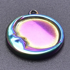 Macro view of iridescent 304 stainless steel moon pendant with polished moon relief detail