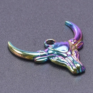 Macro shot of 304 stainless steel bull head pendant with rainbow iridescent electroplating