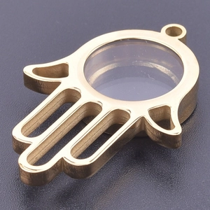 Macro detail of Hamsa Hand locket pendant in gold finish with a clear glass window