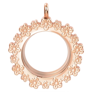 Close-up of rose gold stainless steel locket pendant with floral relief engraving