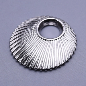 Macro shot of 304 stainless steel round shell pendant with pleated metal texture
