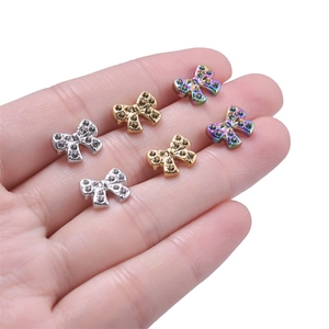 Three pairs of vintage 304 stainless steel bow earrings with sparkling rhinestones set
