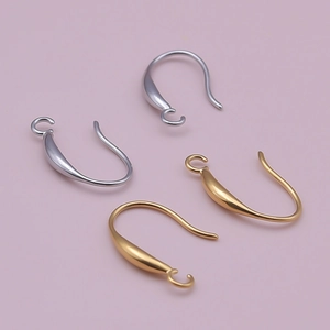 Macro shot of gold and silver teardrop ear hooks for DIY earring making projects