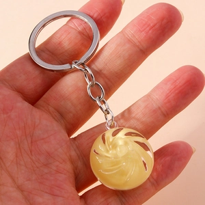 Close-up of cute steamed bun keychain pendant featuring realistic spiral fold details