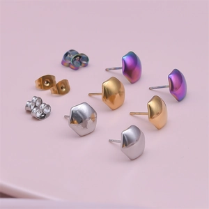 Detailed close-up of irregular 304 stainless steel stud earrings in gold silver and purple