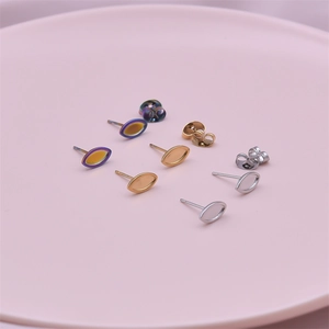 Three pairs of marquise stainless steel earrings in gold, silver, and rainbow finishes