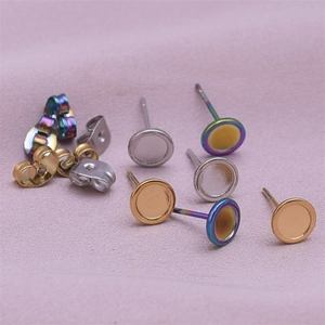 Flat round stainless steel earring posts and butterfly backs in gold and silver finishes