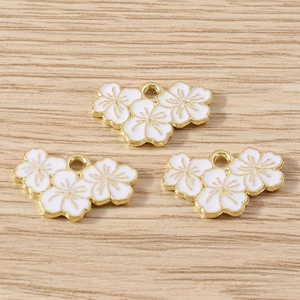 Three-piece cherry blossom flower charms with white enamel and golden alloy details