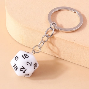 Detailed close-up of a white 20-sided D20 dice keychain with clear black numerals