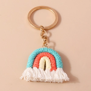 Handmade bohemian rainbow keychain with colorful cotton tassels and gold metal ring