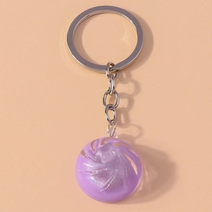 Detail of purple translucent crystal dumpling keychain with silver metal chain ring
