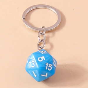Macro shot of blue 20-sided D20 dice keychain with clear white numbers and silver ring