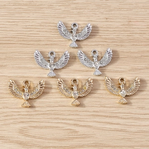 Pack of six eagle pendants in gold and silver finish with sparkling rhinestone details