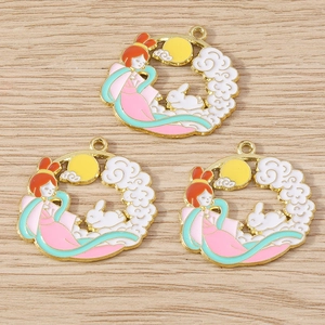 Macro detail of Chinese mid-autumn enamel charms featuring Chang'e and jade rabbit