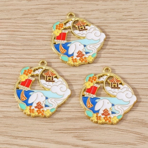 Detailed macro view of Chinese style enamel rabbit pendants for Mid-Autumn DIY jewelry making