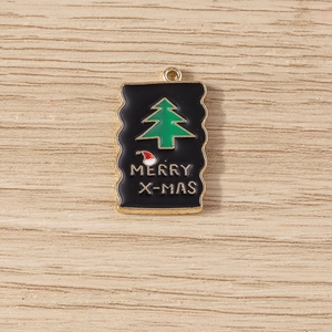 Detailed macro view of a Christmas tree alloy pendant with wave edges on wooden background