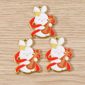 Detailed close-up of cute enamel bunny charms for DIY jewelry with traditional Chinese elements