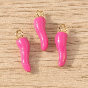 Detailed view of three glossy rose pink cornicello charms for DIY jewelry making