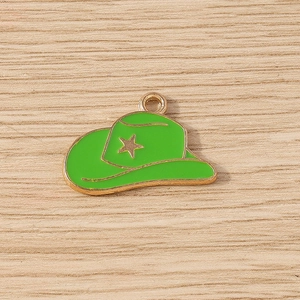 Detail of green enamel cowboy hat pendant with gold star for DIY jewelry making