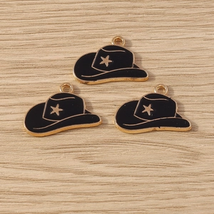Detail view of black enamel cowboy hat charms with gold star for DIY jewelry crafting