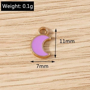 Detail showing 11x7mm purple crescent moon enamel charms for DIY jewelry making