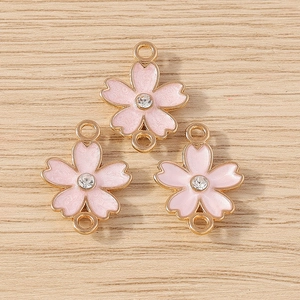 Pink enamel cherry blossom pendants with gold alloy base and central crystal for DIY jewelry