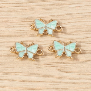Three green butterfly charms with gold frames and double loops for DIY jewelry making