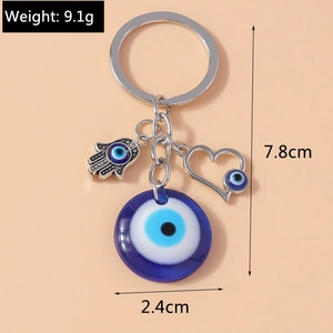 Detail view of Evil Eye keychain with Hamsa Hand and heart charm including dimensions
