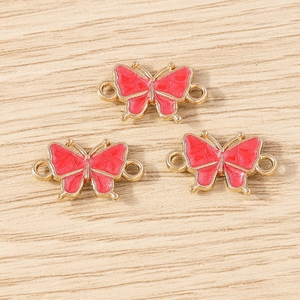 Three red enamel butterfly charms with gold metal edges and double loops for DIY jewelry
