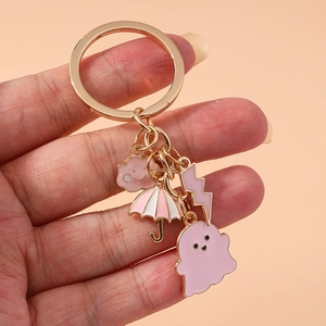 Pink cartoon ghost umbrella keychain with gold alloy rings and charms for bags