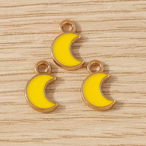 Three yellow enamel crescent moon charms with rose gold alloy frames for DIY jewelry