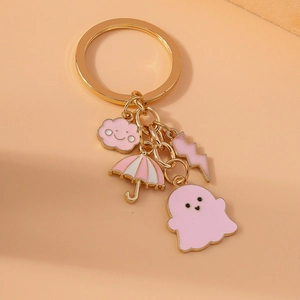 Cute pink ghost and cloud keychain with umbrella and lightning charms on a gold ring
