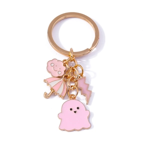 Cute pink ghost keychain set with umbrella and lightning charms on a gold metal ring