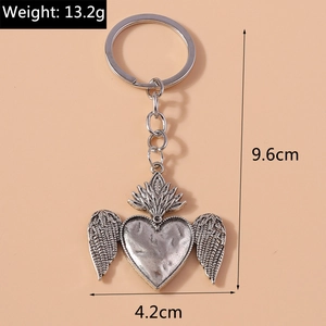 Detailed view of retro silver heart wing keychain with 9.6cm length measurements