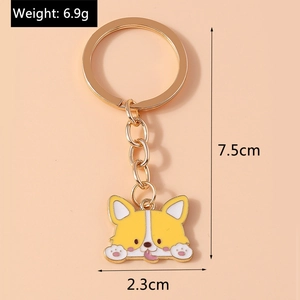 Detailed view of cartoon Corgi keychain with yellow enamel and gold plated metal links
