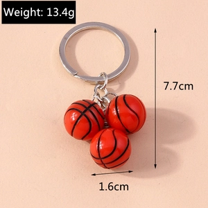 Detail view of 3D basketball keychain showing dimensions 7.7cm length and 13.4g weight