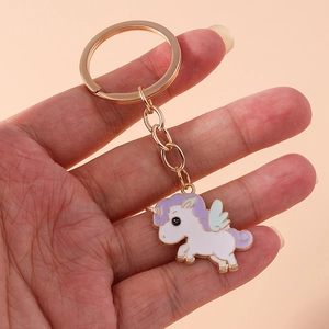 Cartoon unicorn keychain with lavender and mint enamel charm on a gold metal ring