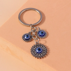 Vintage evil eye keychain with blue glass charms and silver metal ring for bags
