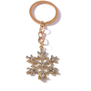 Sparkling snowflake rhinestone keychain with golden alloy finish and white crystals