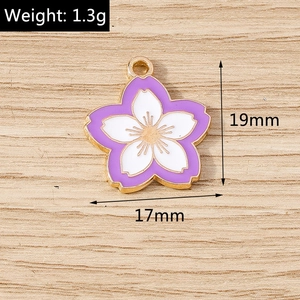 Detail view of 19mm purple and white enamel cherry blossom pendant with golden alloy frame