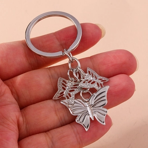 Fashion silver butterfly keychain featuring tiered metal pendants and minimalist keyring