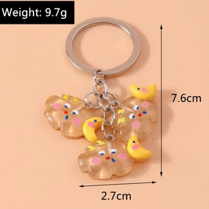 Détail du porte-clés nuage avec dimensions 7,6 cm par 2,7 cm et un poids de 9,7 g