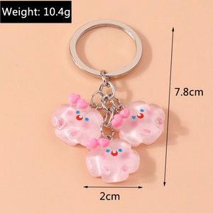 Vue détaillée des pendentifs nuages roses translucides avec dimensions 7,8 cm et poids 10,4 g